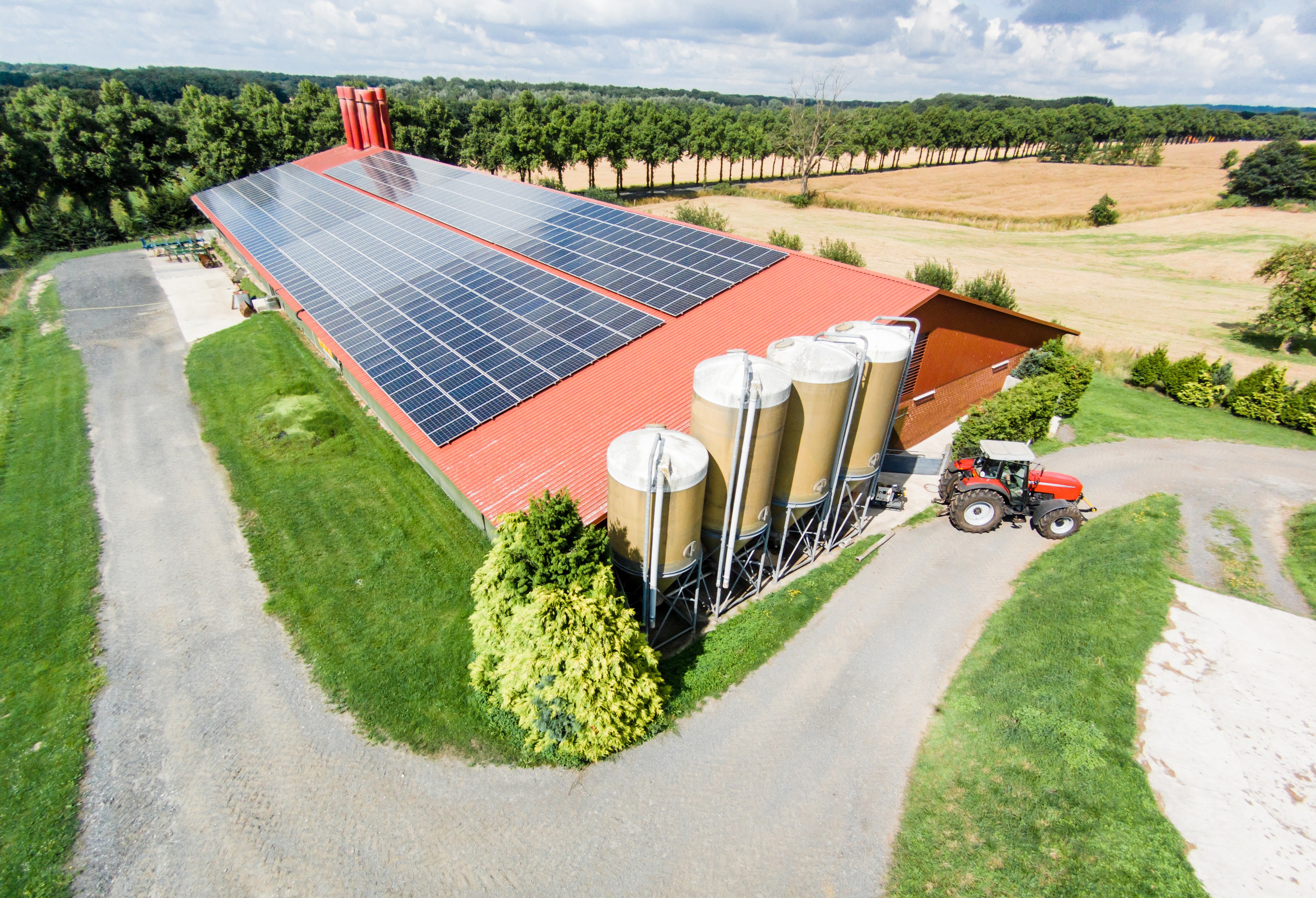 a row of solar panels in a field