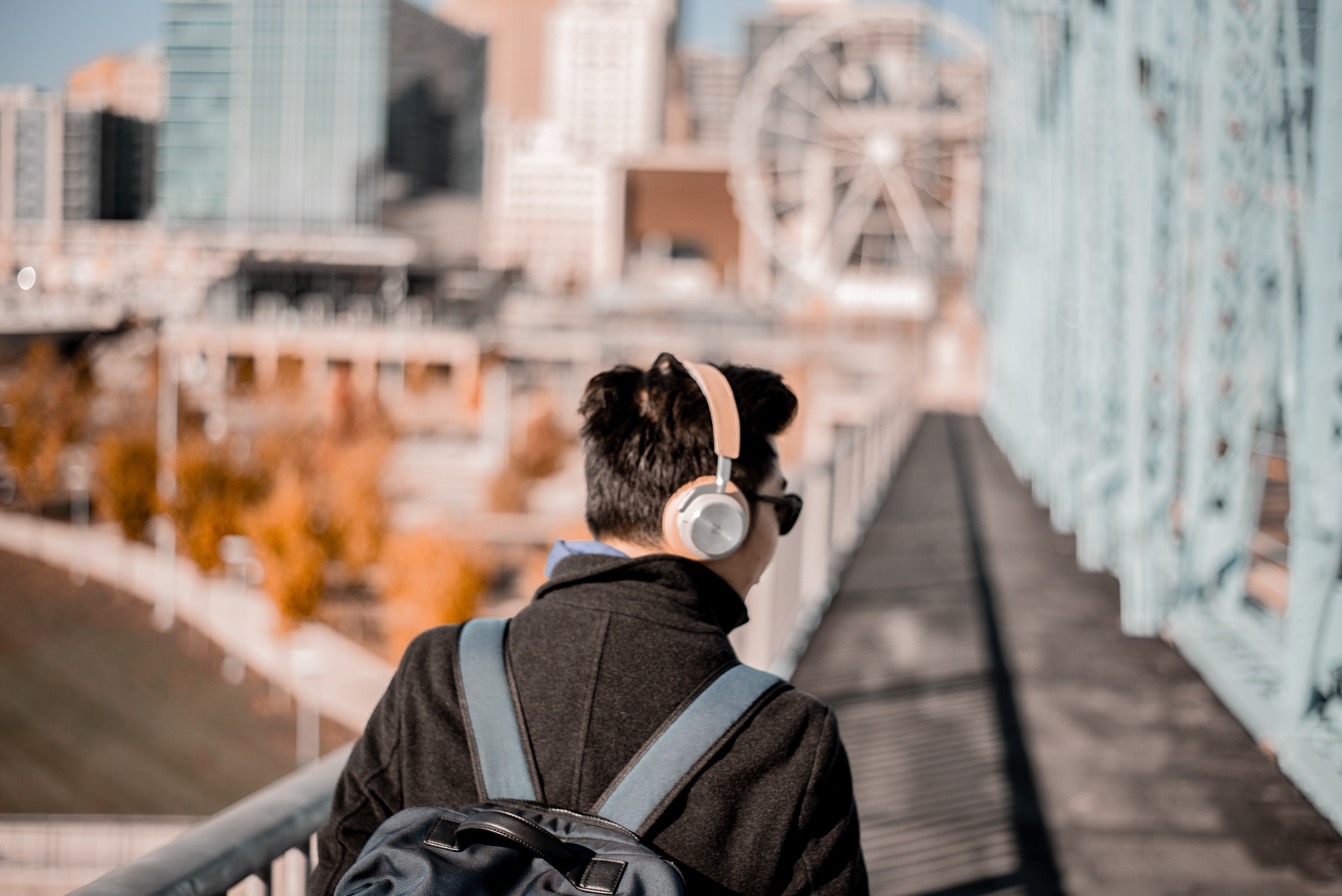 man walking down a brige and listening to music - ai artist singing other songs