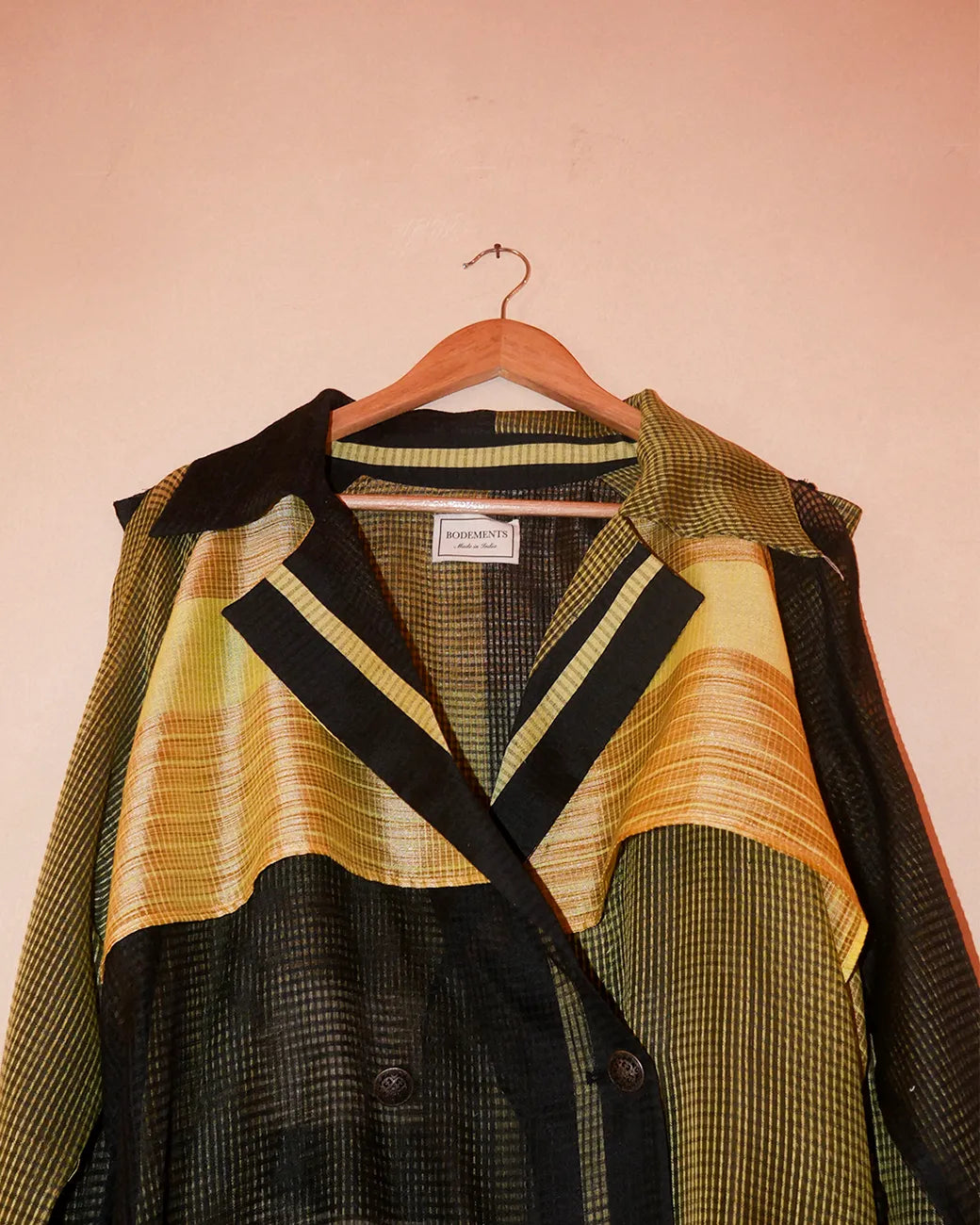 Vedya Black checkered silk trench coat handcrafted from South Indian silk with relaxed boxy fit, buckle details on arms and waist