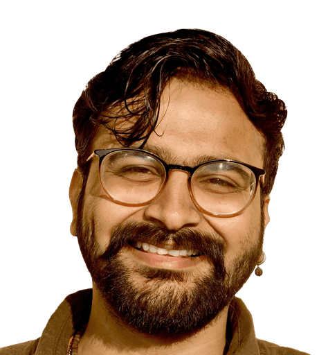 Image of man wearing glasses and smiling, looking to his right