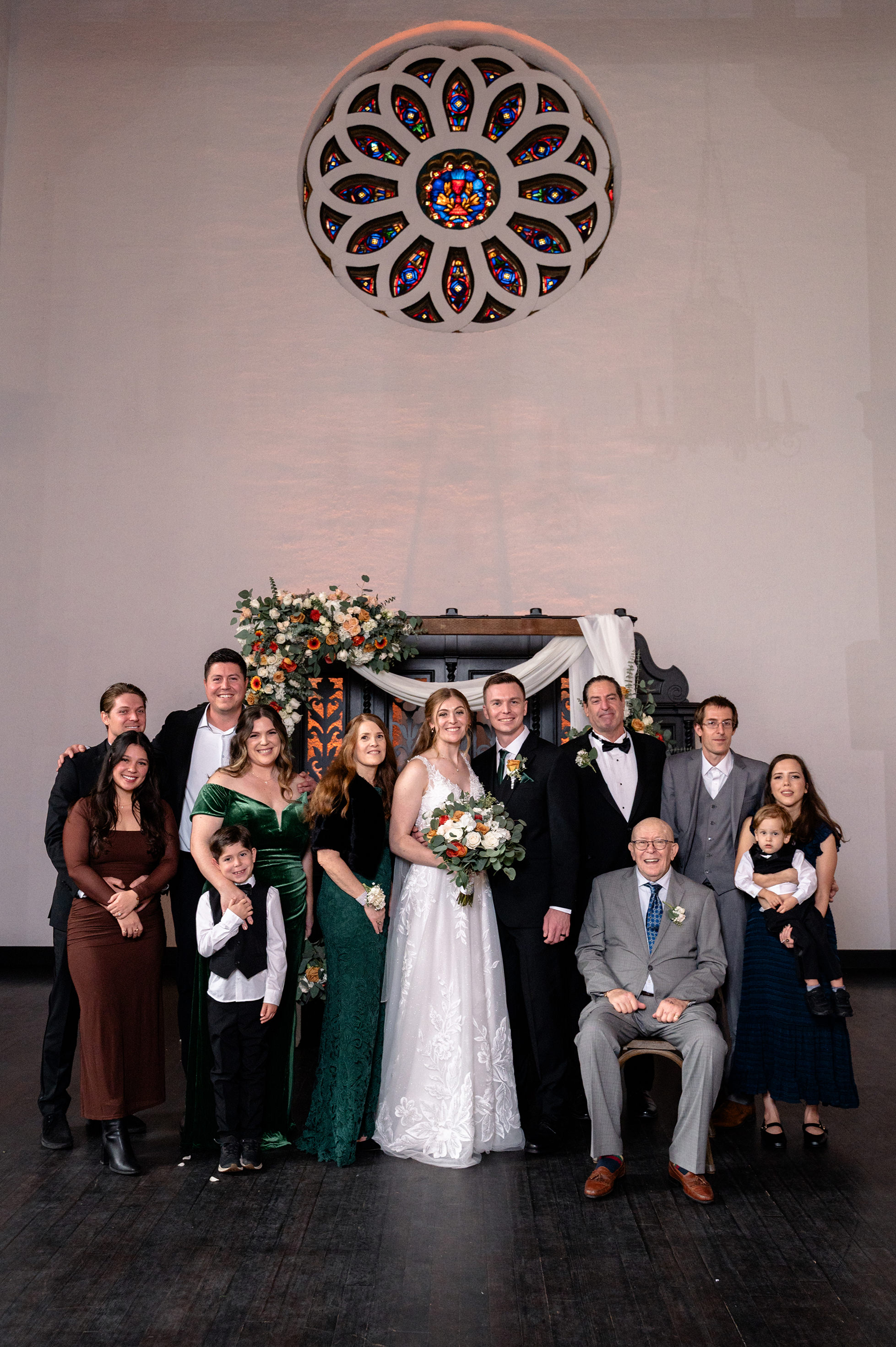 Flat lay wedding details with bouquet, rings, and sparkling bridal heels