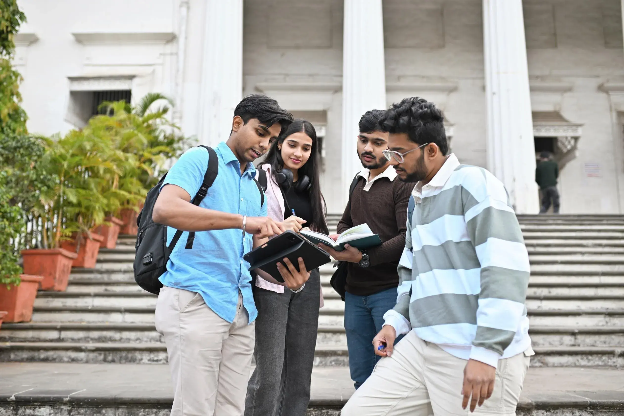 Students chatting on a college campus about Multiple Entrance Exams for Engineering and Hhw to Pick 2–3 Exams Alongside JEE + Prep Plan