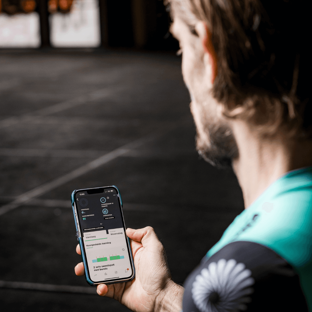 Cyclist looking at fitness app