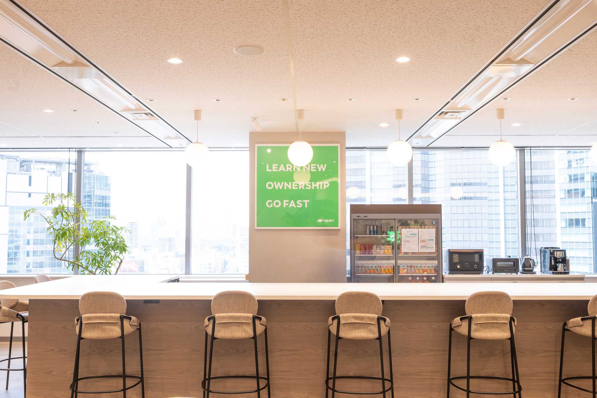 NEWT Premium Lounge counter area with city view