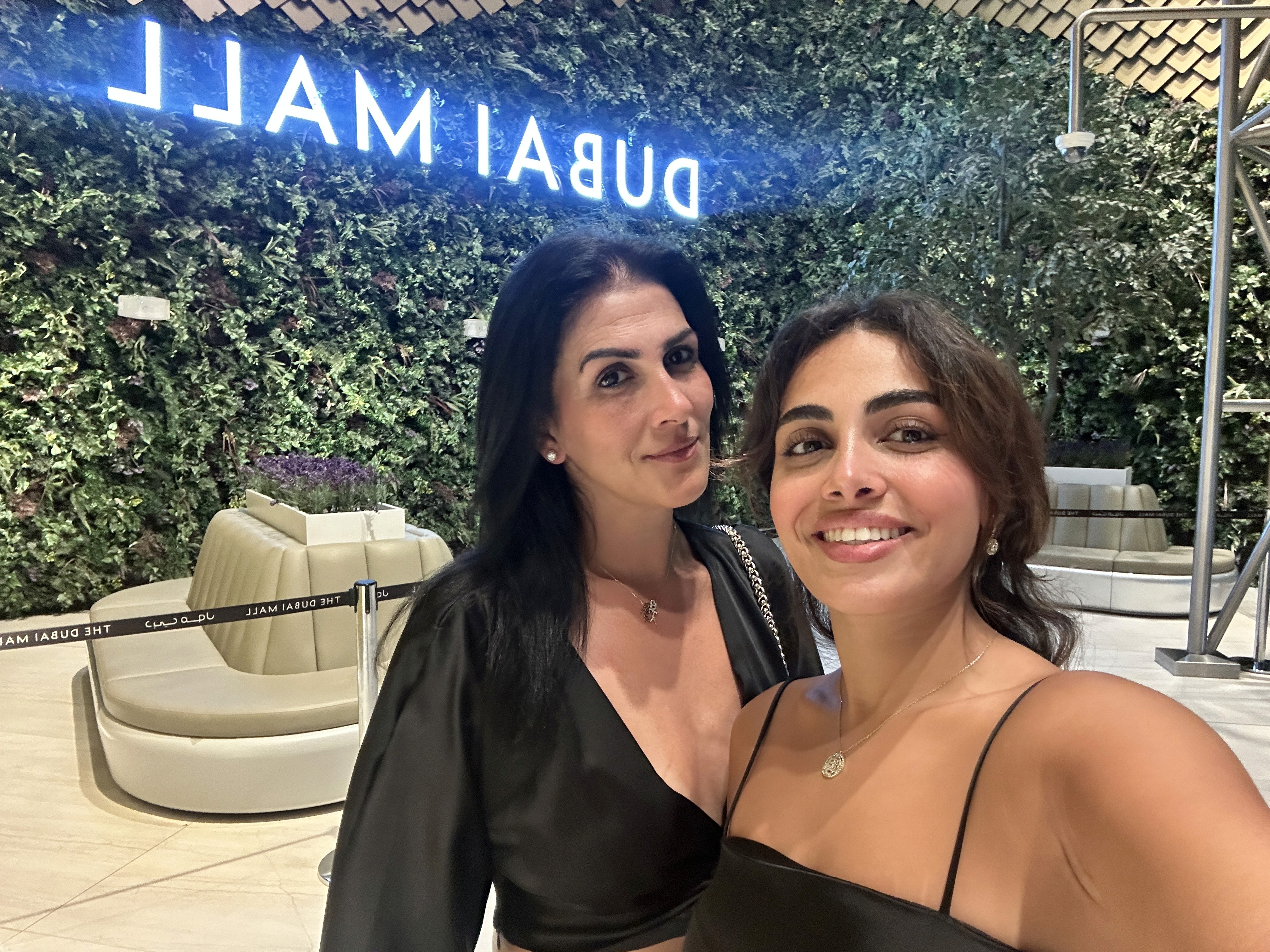 Person sitting on a ledge overlooking New York City skyline
