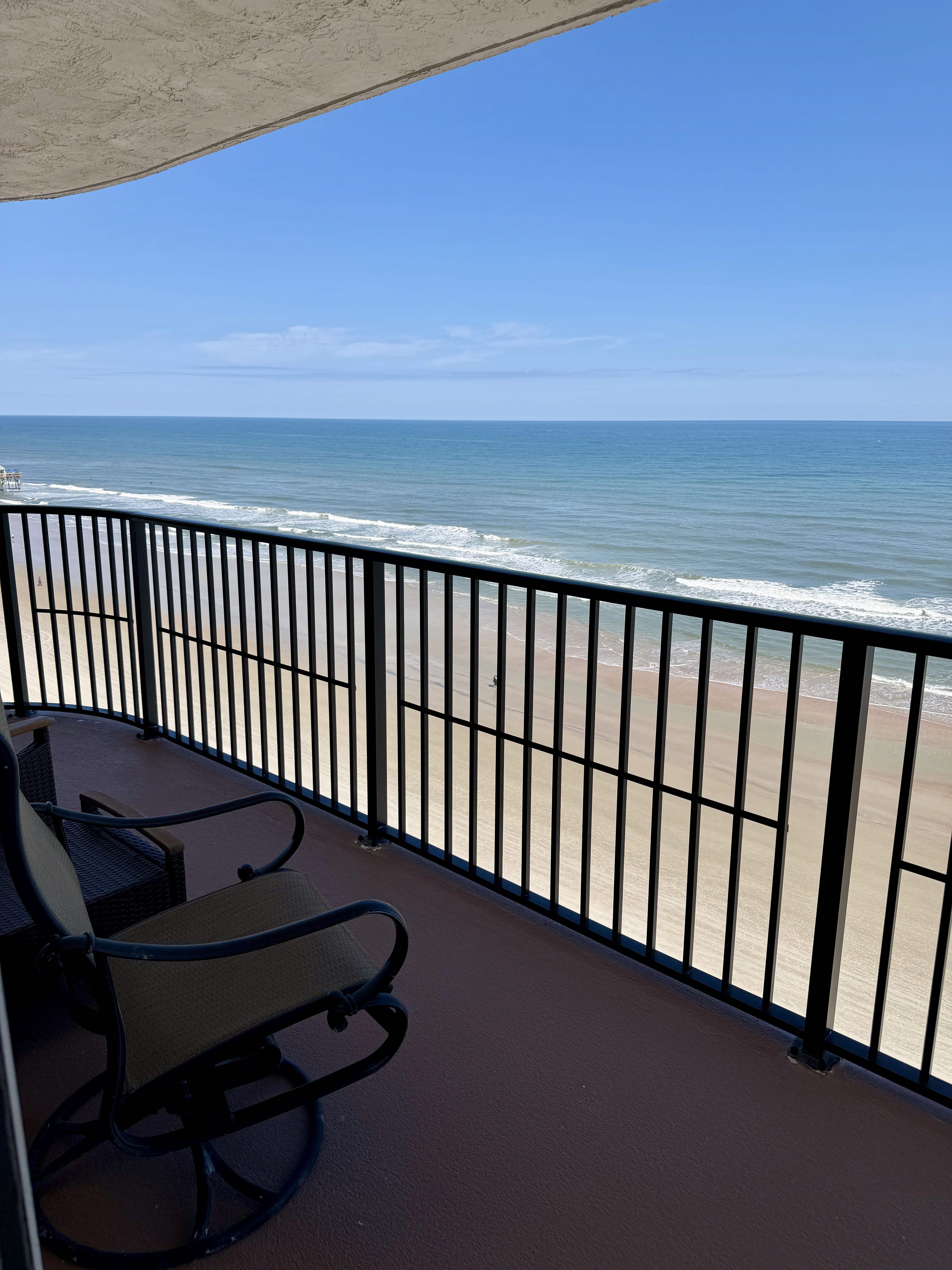 Balcony with chairs overlooking the ocean and beach, Unit 903 at The Ashley, a vacation rental in Daytona Beach Shores