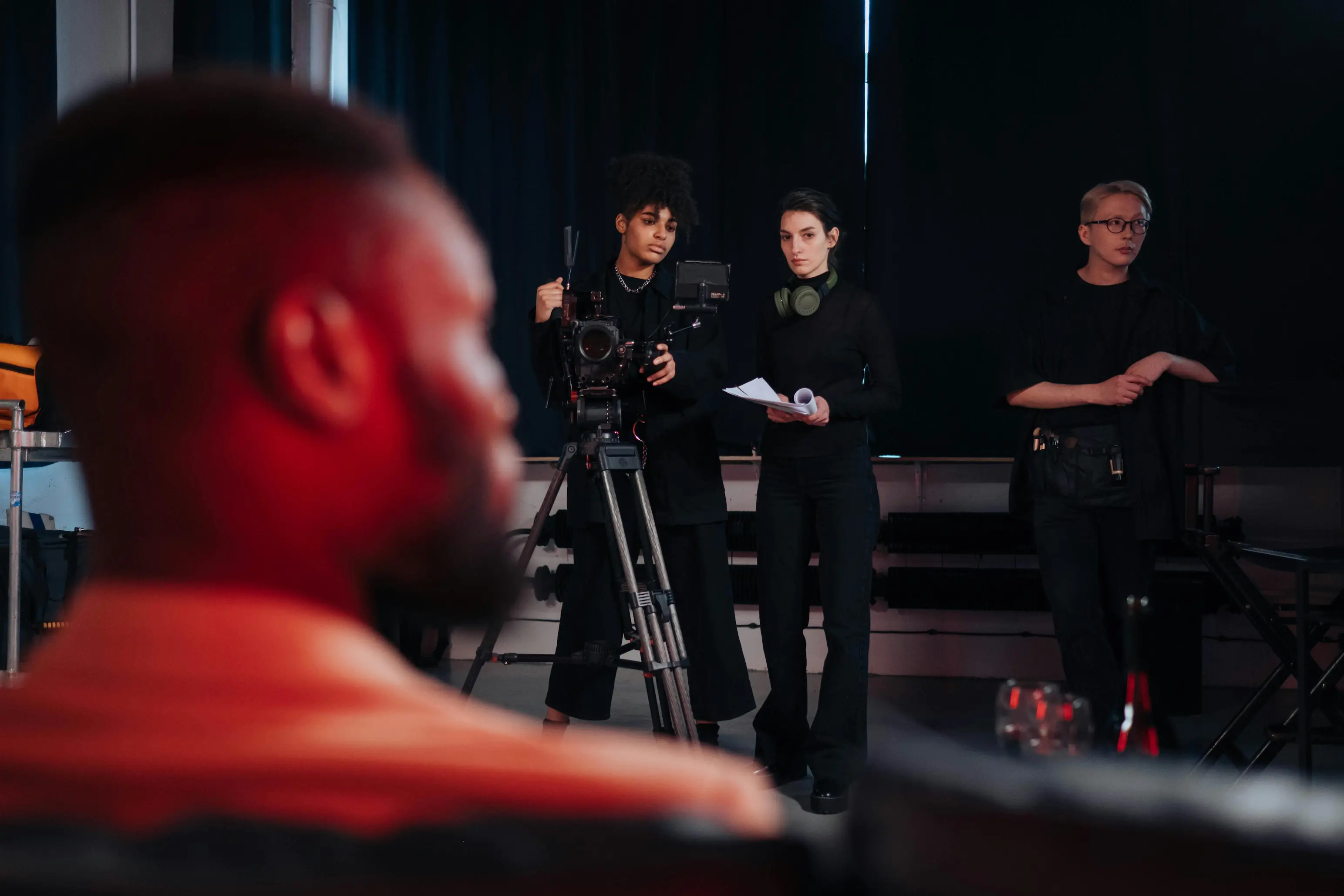 Film crew filming studio with cameras.