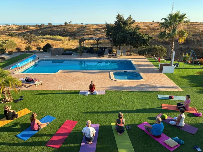 Intimate Algarve yoga retreat in charming hilltop villa with daily practice, beach sessions, spa, and nourishing meals.