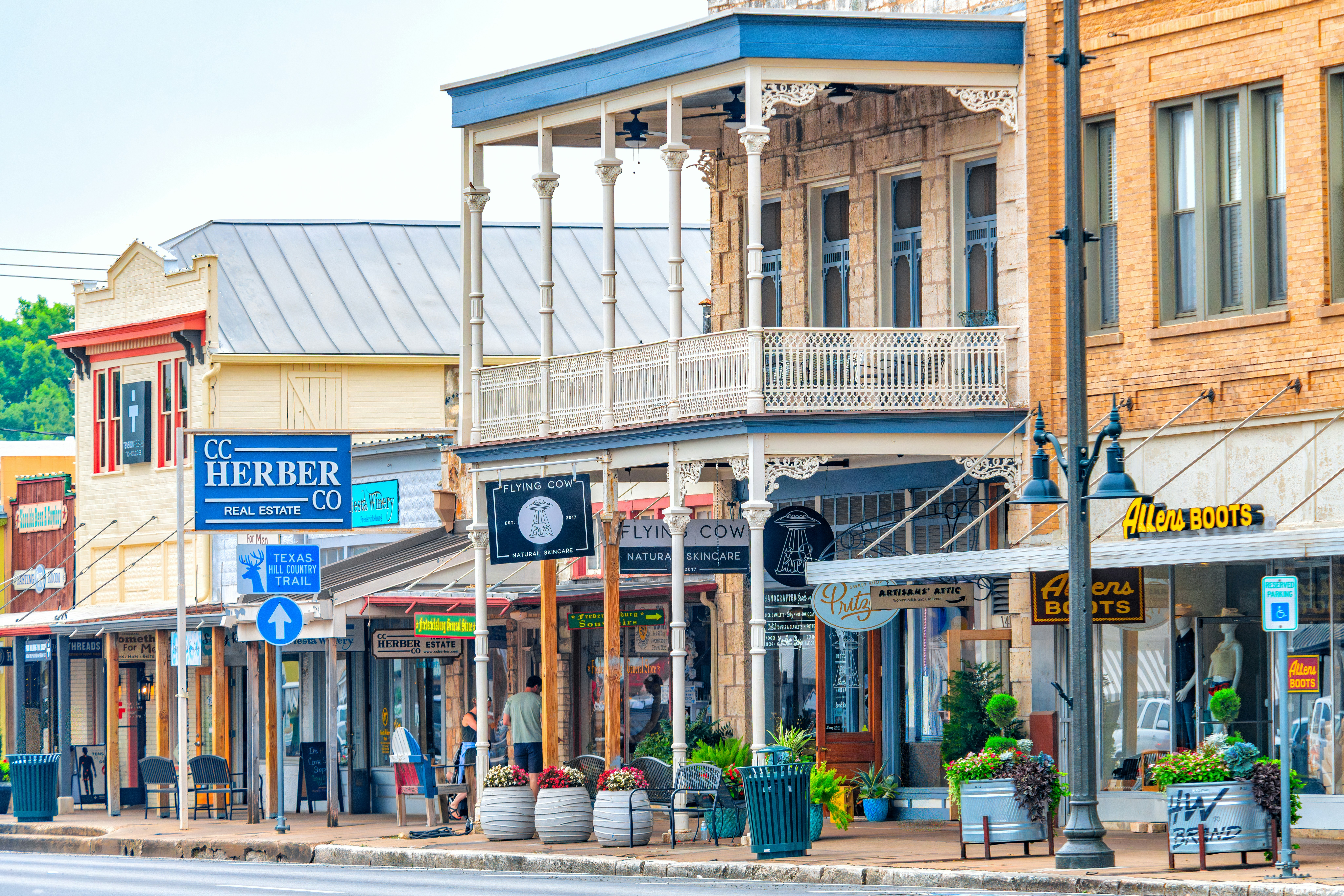 Historic storefronts line a charming small-town street.