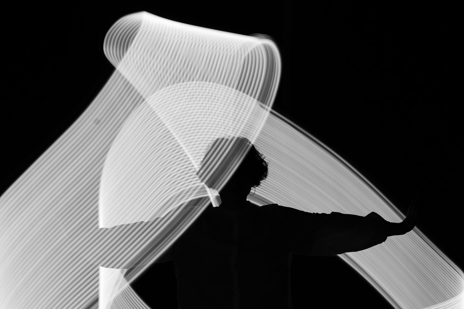 black and white, beams of light, a person in between