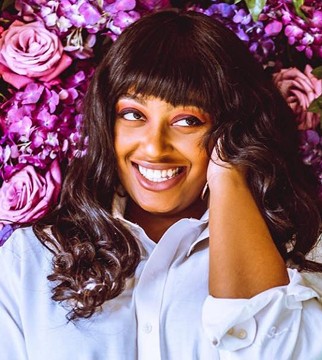 headshot of female in bright background