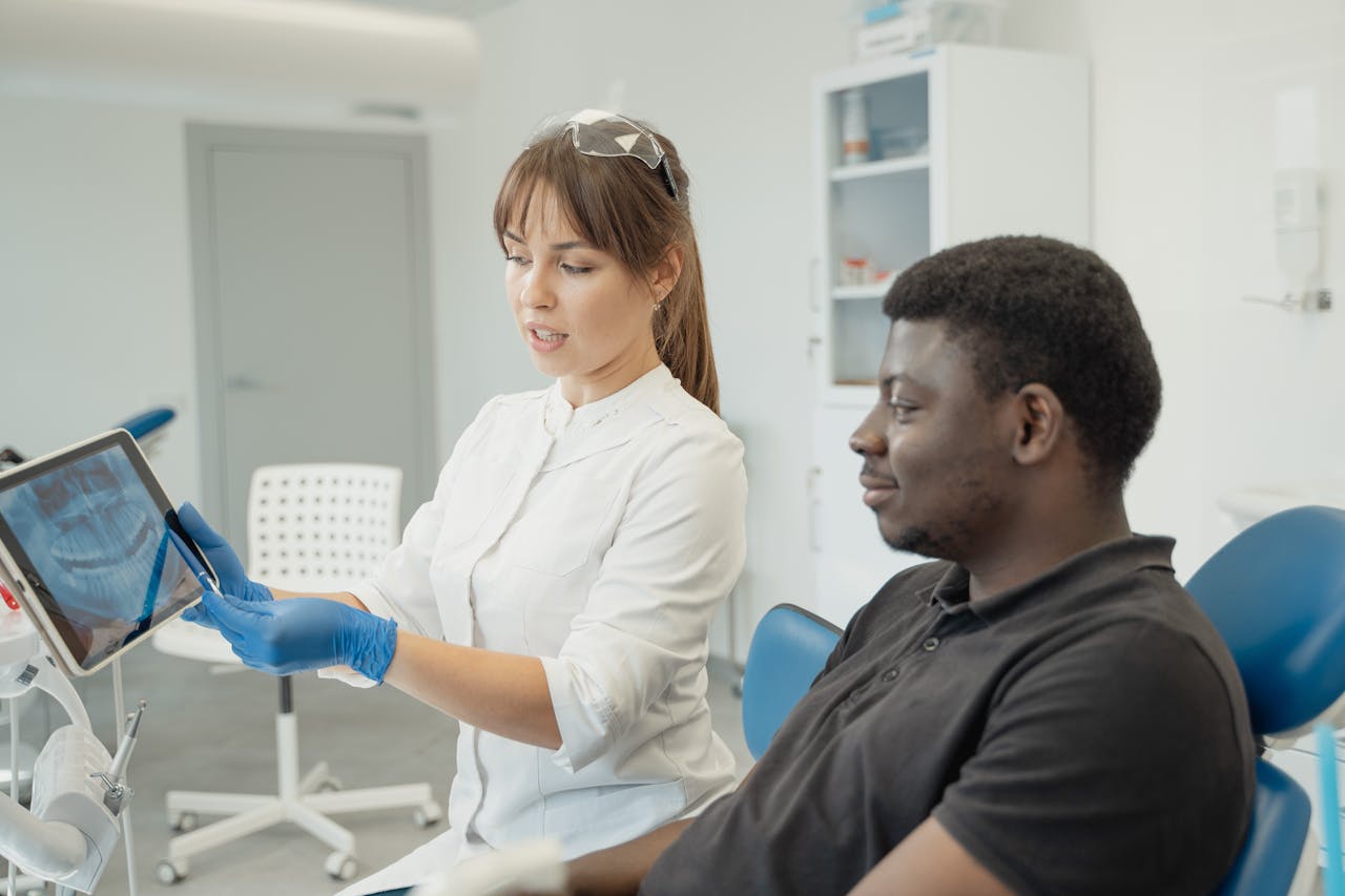 A dental hygienist interacting with their patient