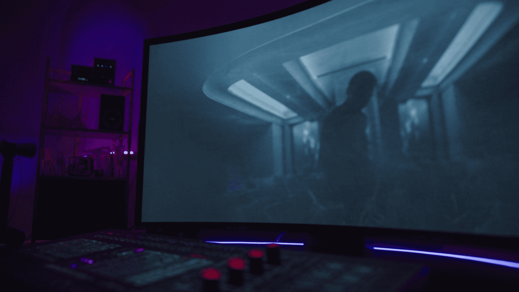 Professional color-grading suite with reference monitor showing a luxury Chicago condo lobby