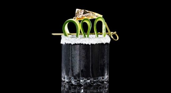 A closeup of a Sweet, Year Round Black Gold drink against a dark background.