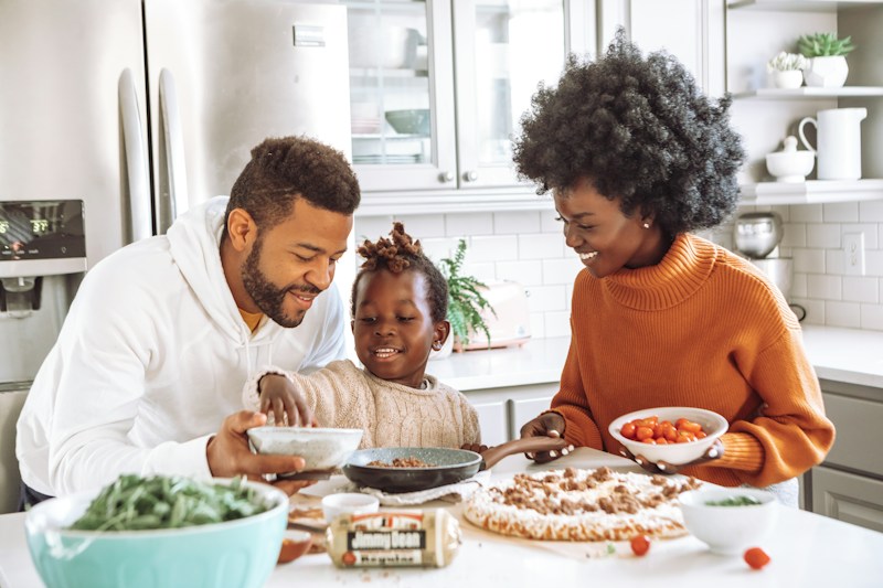 Family sharing a meal in their kitchen