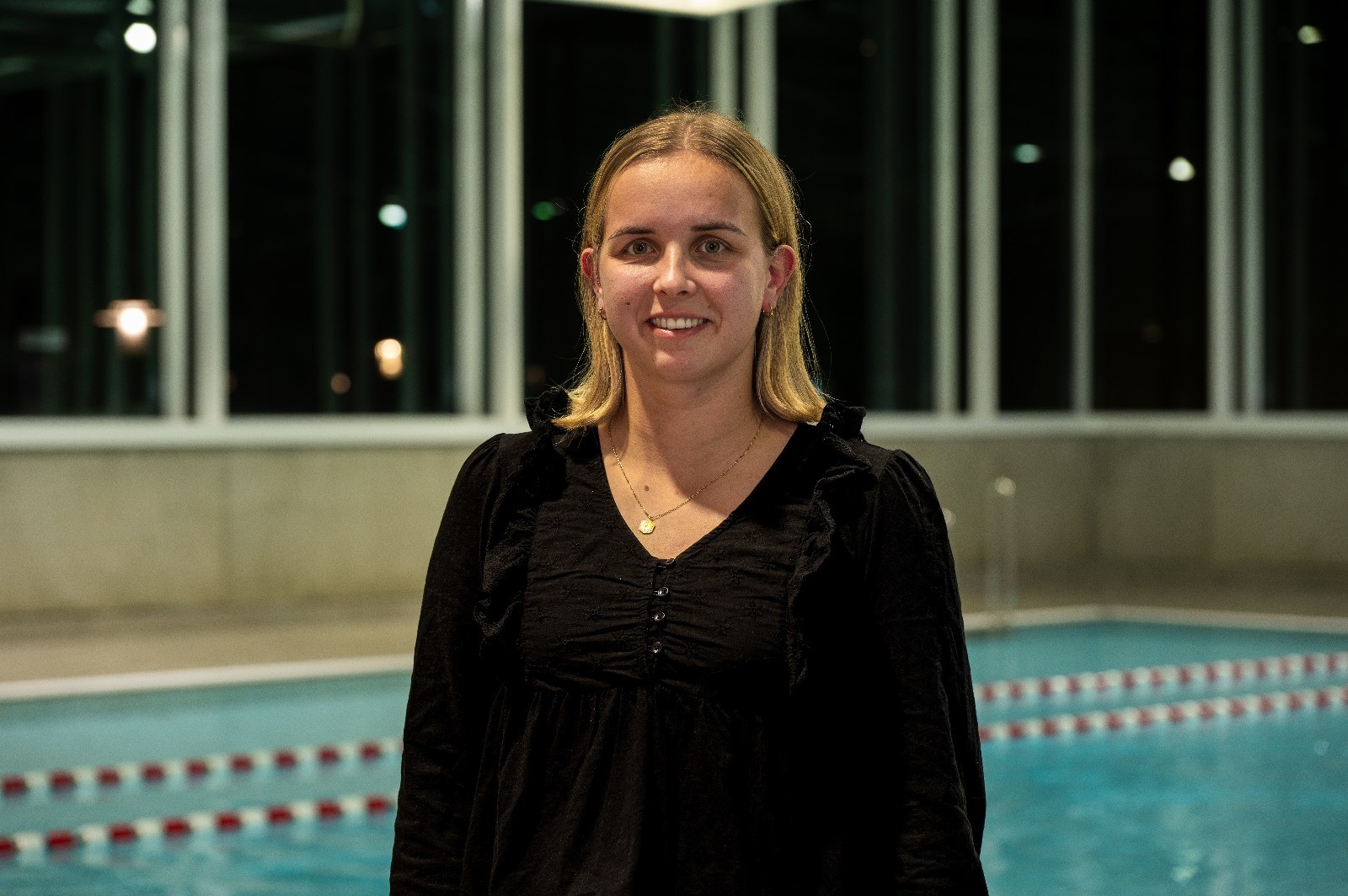woman in red tube dress in water
