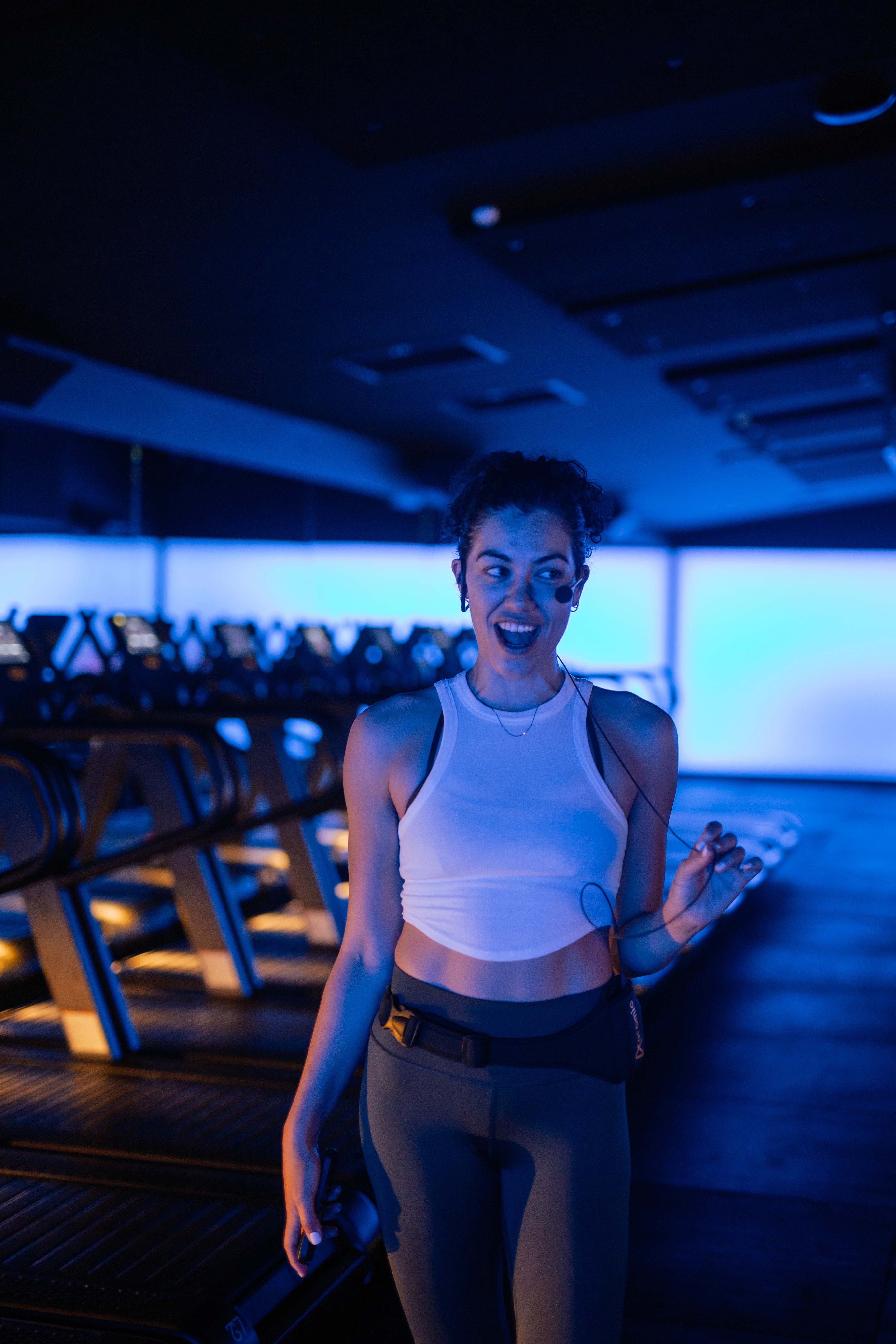 Black cosmetic product bottle against a dark background