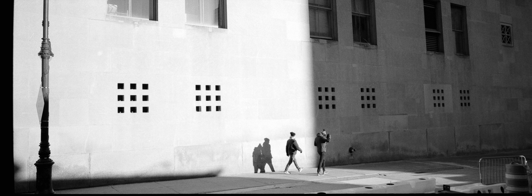 Photographing shadows on film: A street scene with bright light and hard shadows, but no detail is lost