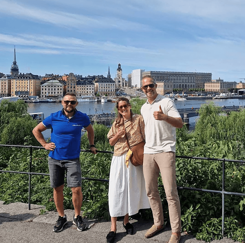 Tourists exploring Stockholm during private electric sightseeing cart tour