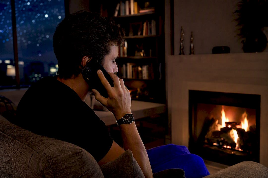 Real estate agent on phone at night