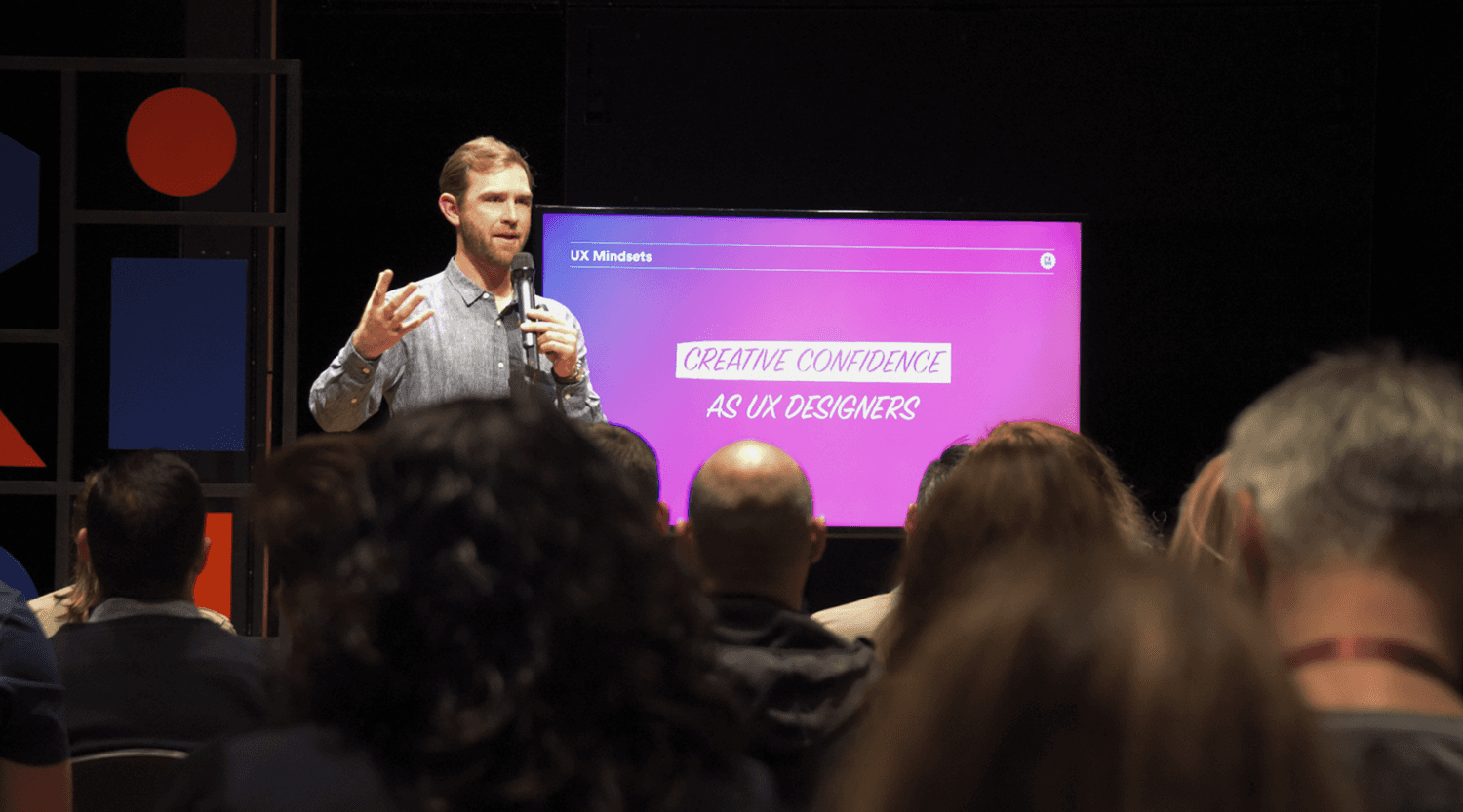 A focused designer at a laptop, representing lateral influence and self-directed leadership.