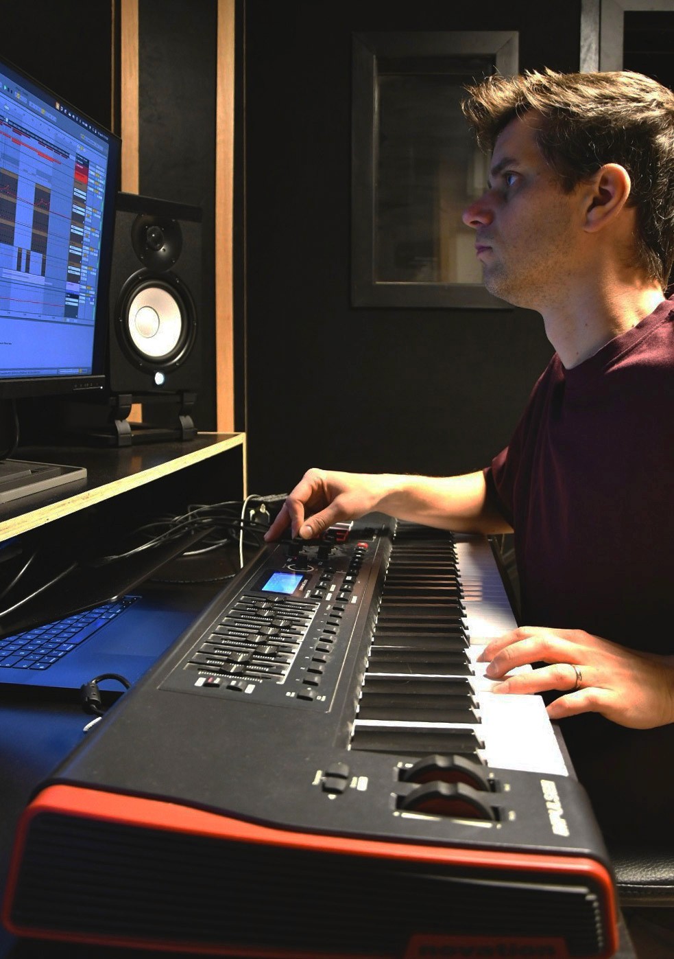 Music Producer sitting at his desk