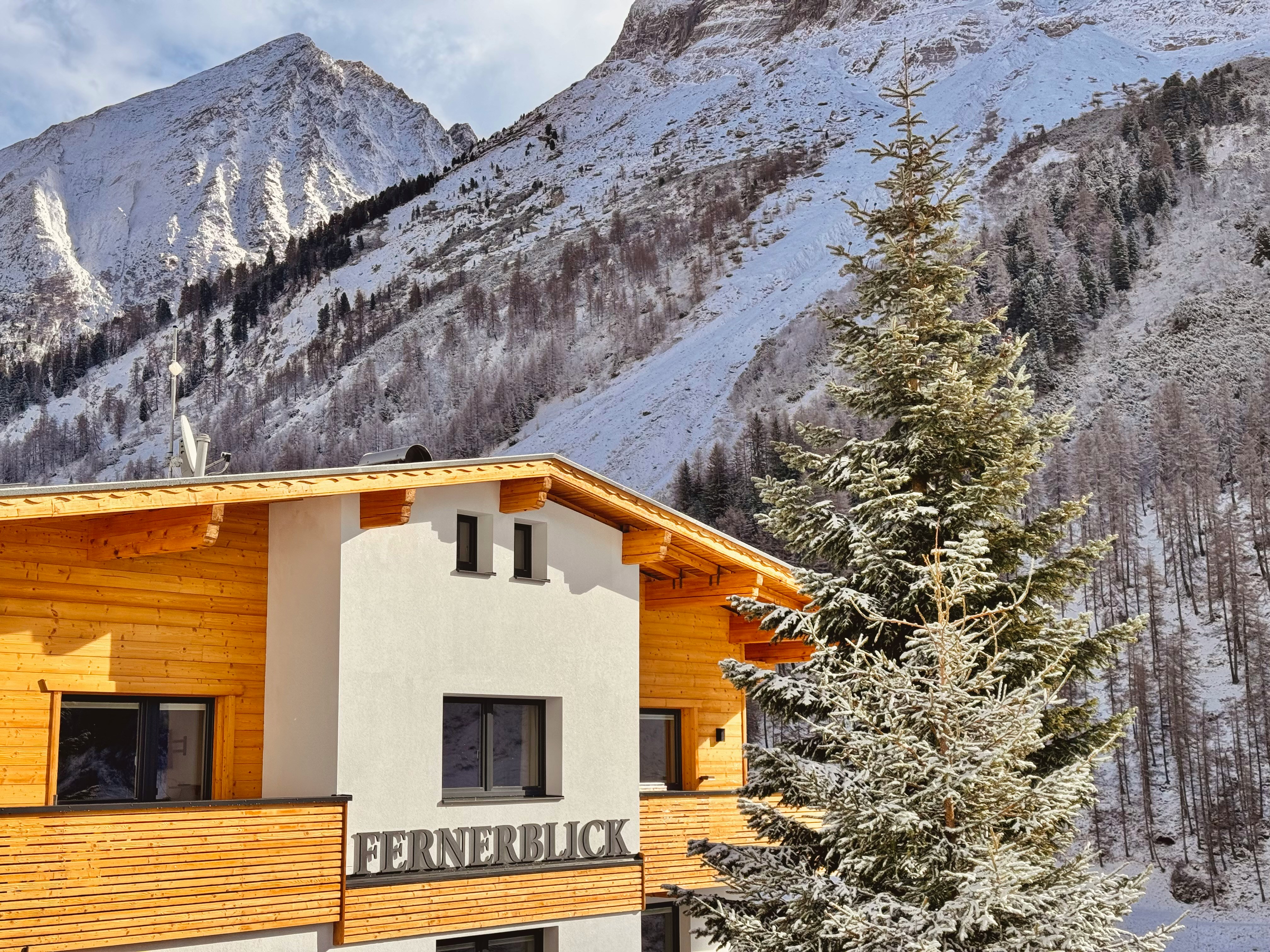 Modern wooden building in snowy mountains