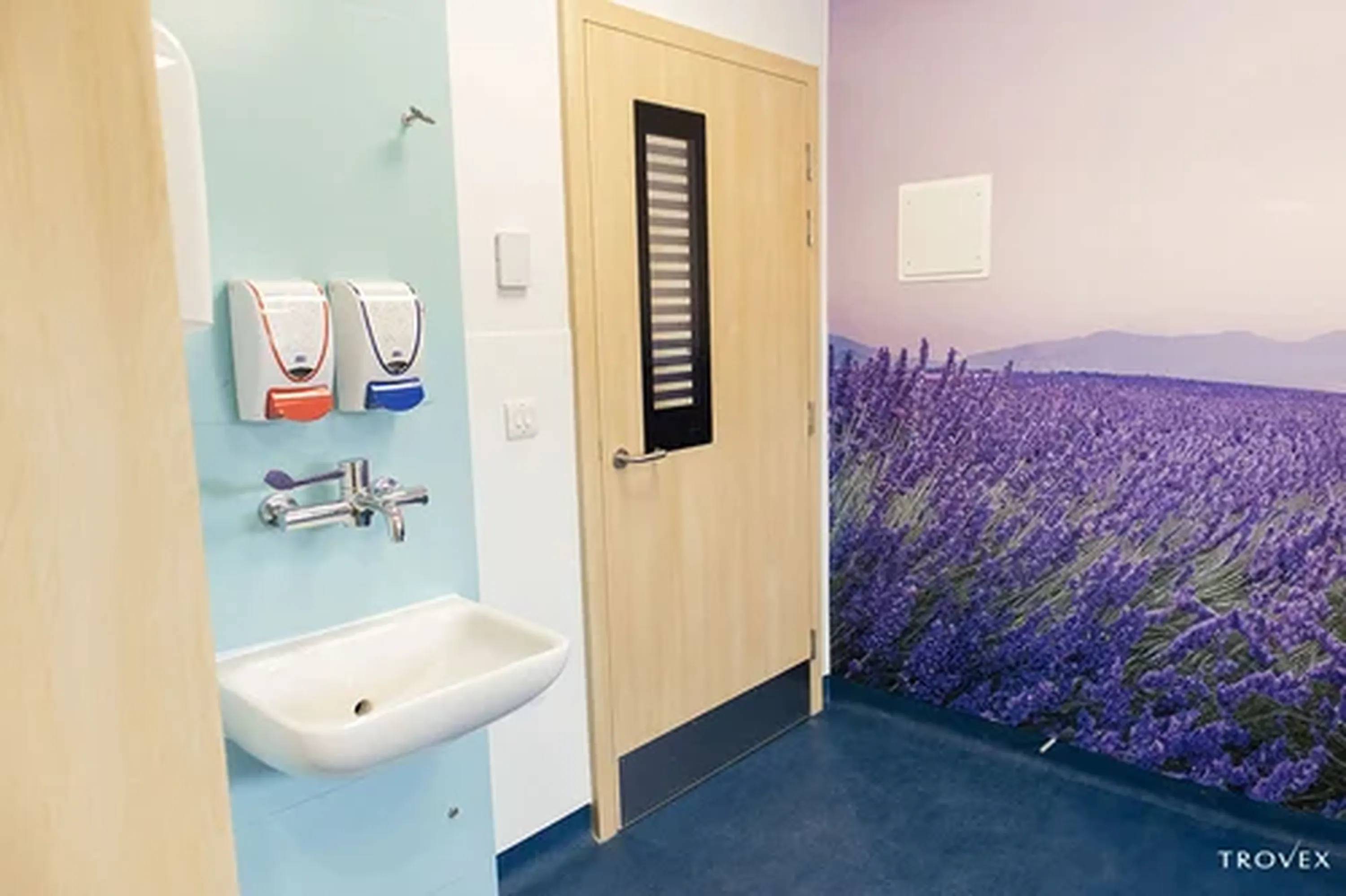 The Hygidoor in a woodgrain finish between the Hygipod IPS and Gallery pvc wall cladding