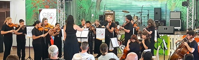 Indoor rehearsal session with Cairns String Orchestra students preparing for a concert