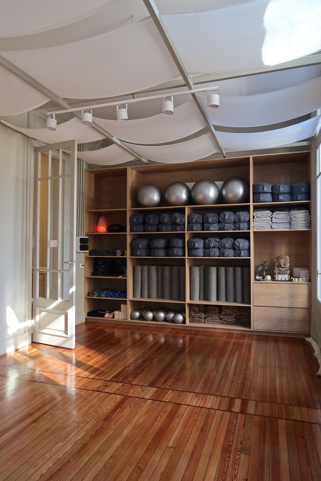 Shirtless man meditating indoors
