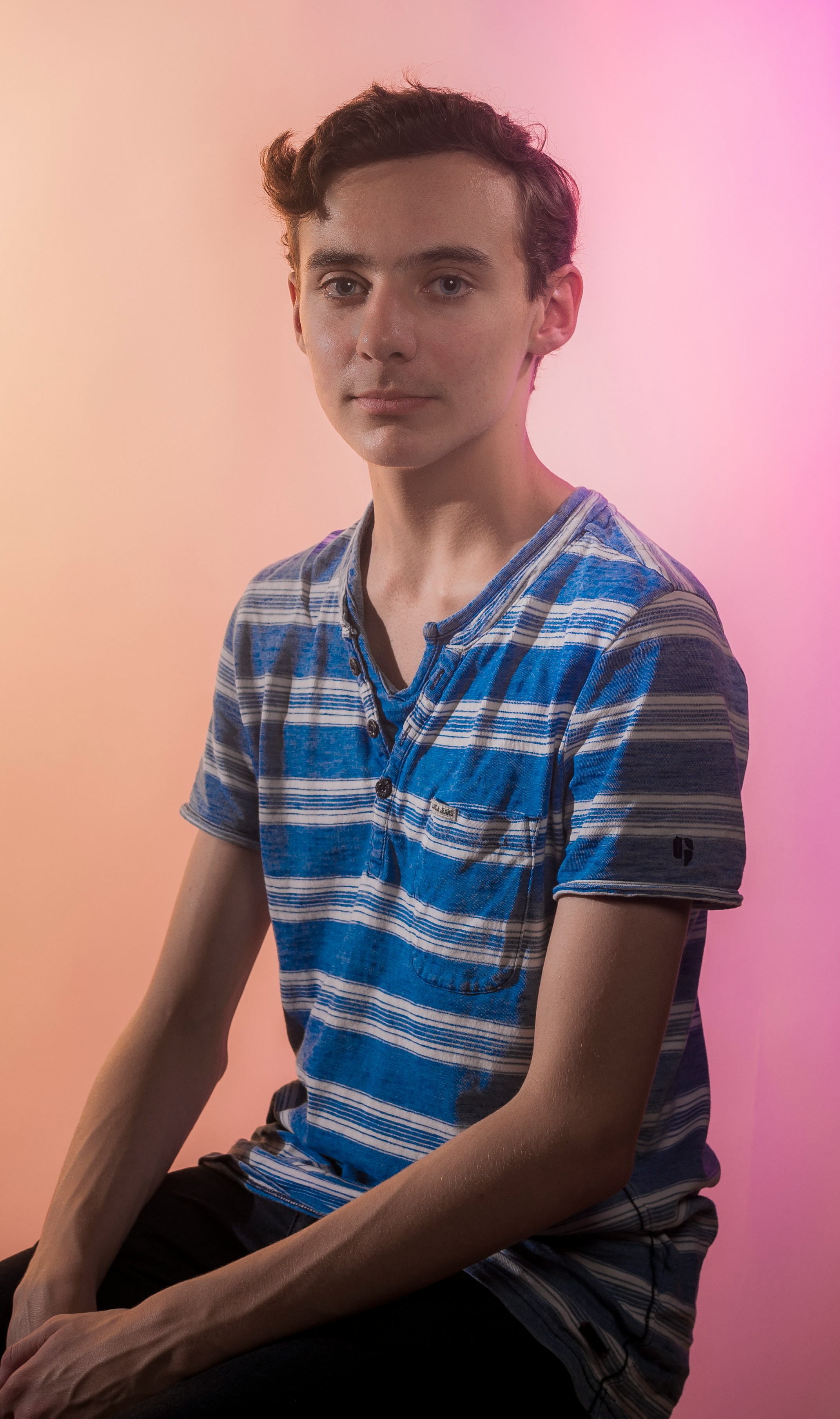 man in blue and white striped shirt