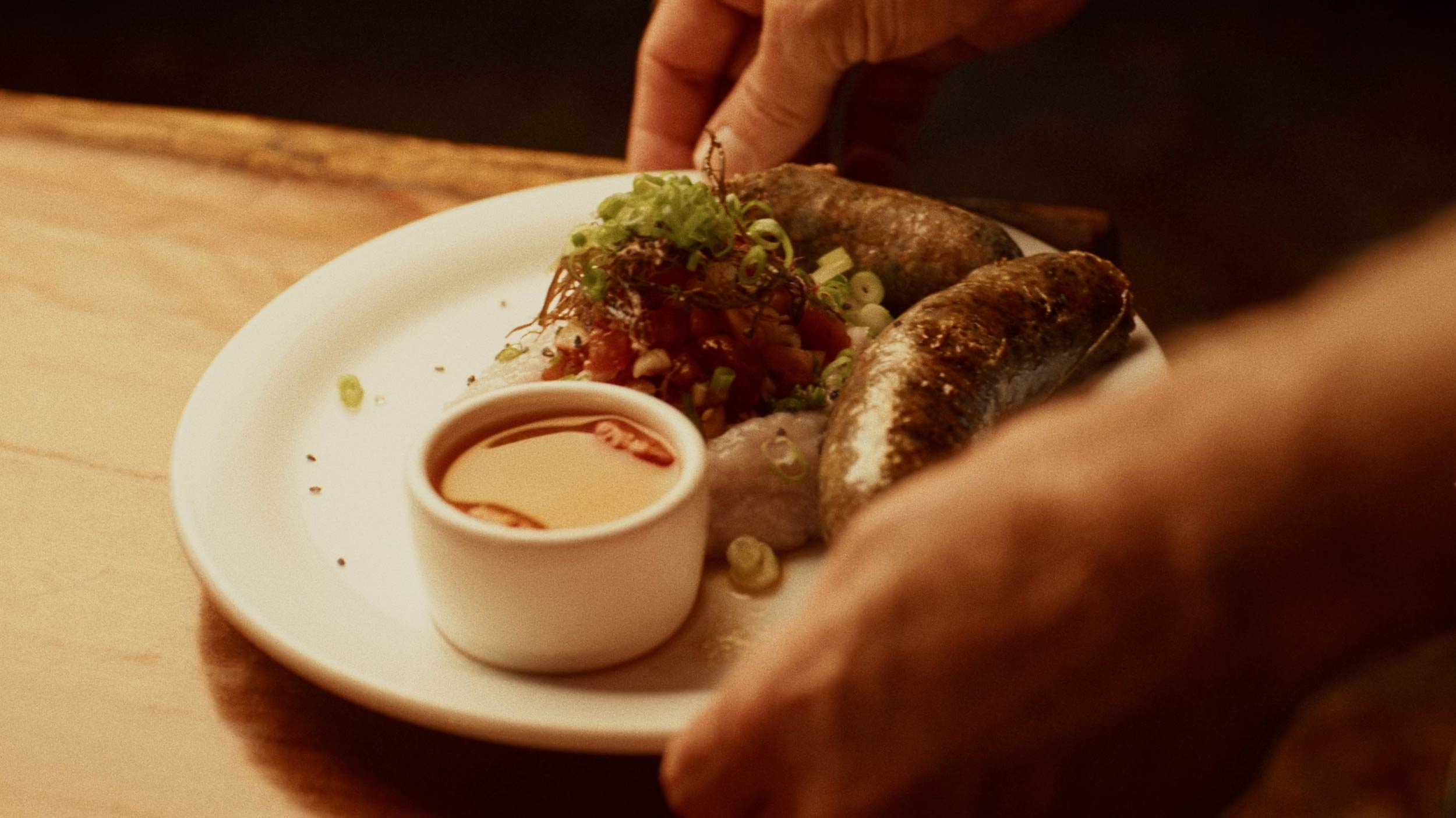 Streetside billboard with flyposters of the Batch.Works brand and illustrations