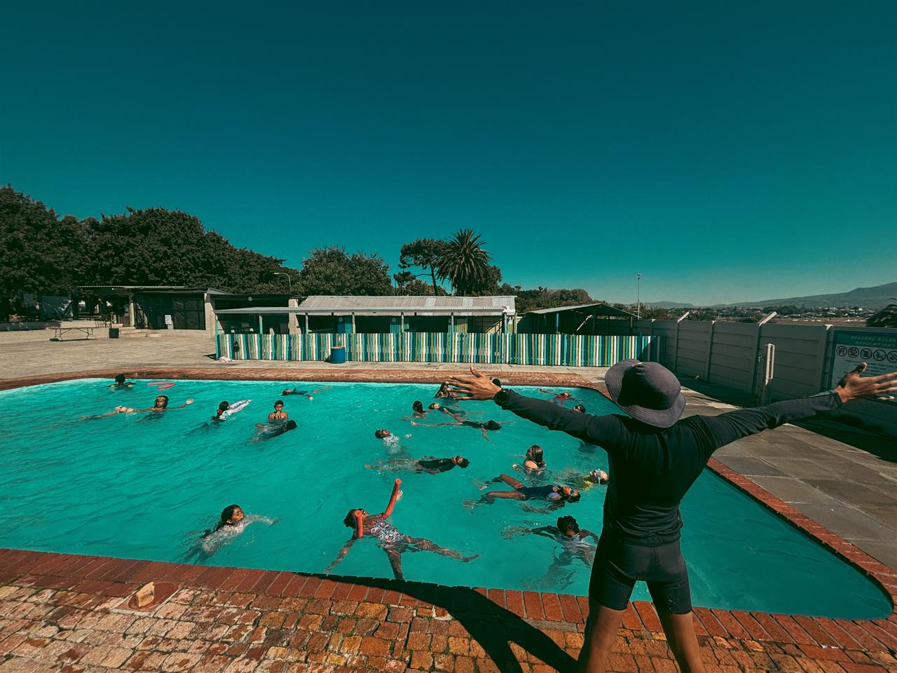 a group of kids in a pool