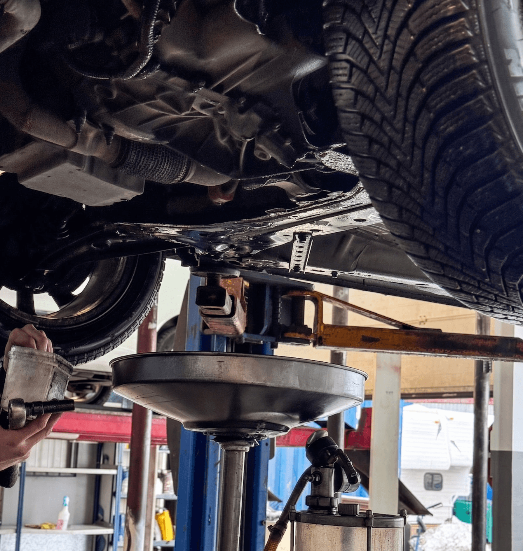 a garage filled with lots of different colored cars