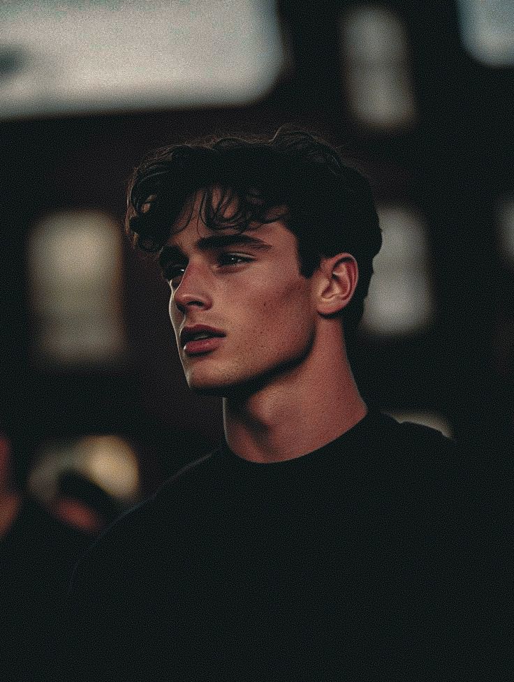 woman in black long sleeve shirt sitting on white couch