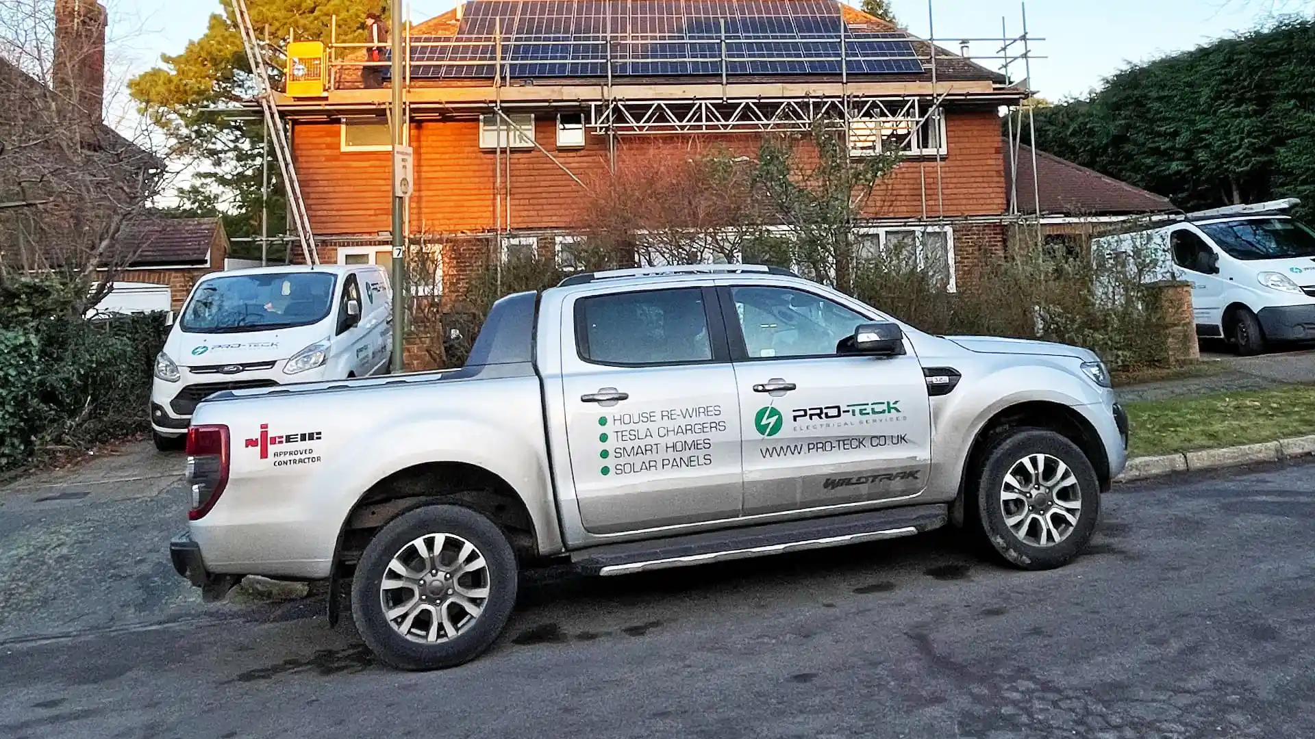 Pro-Teck's branded truck over the new installation of solar panelling on the pitched roof