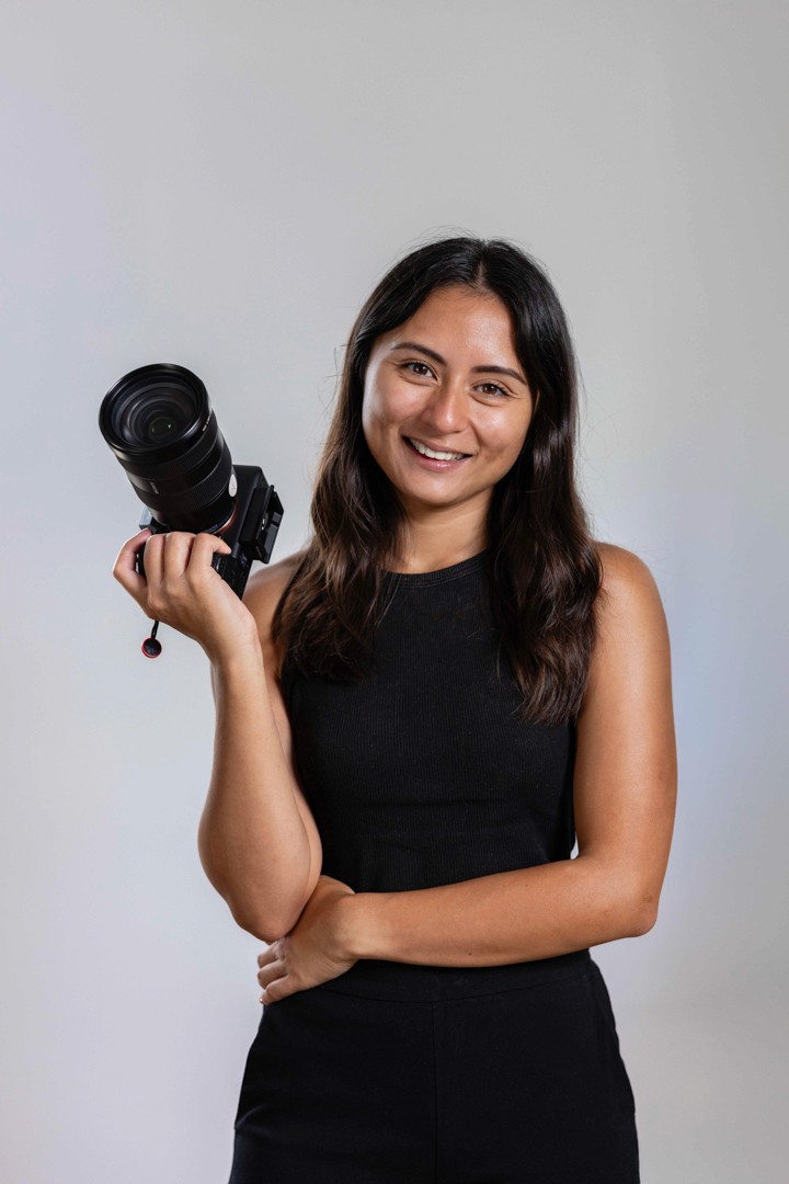 Young woman holding camera