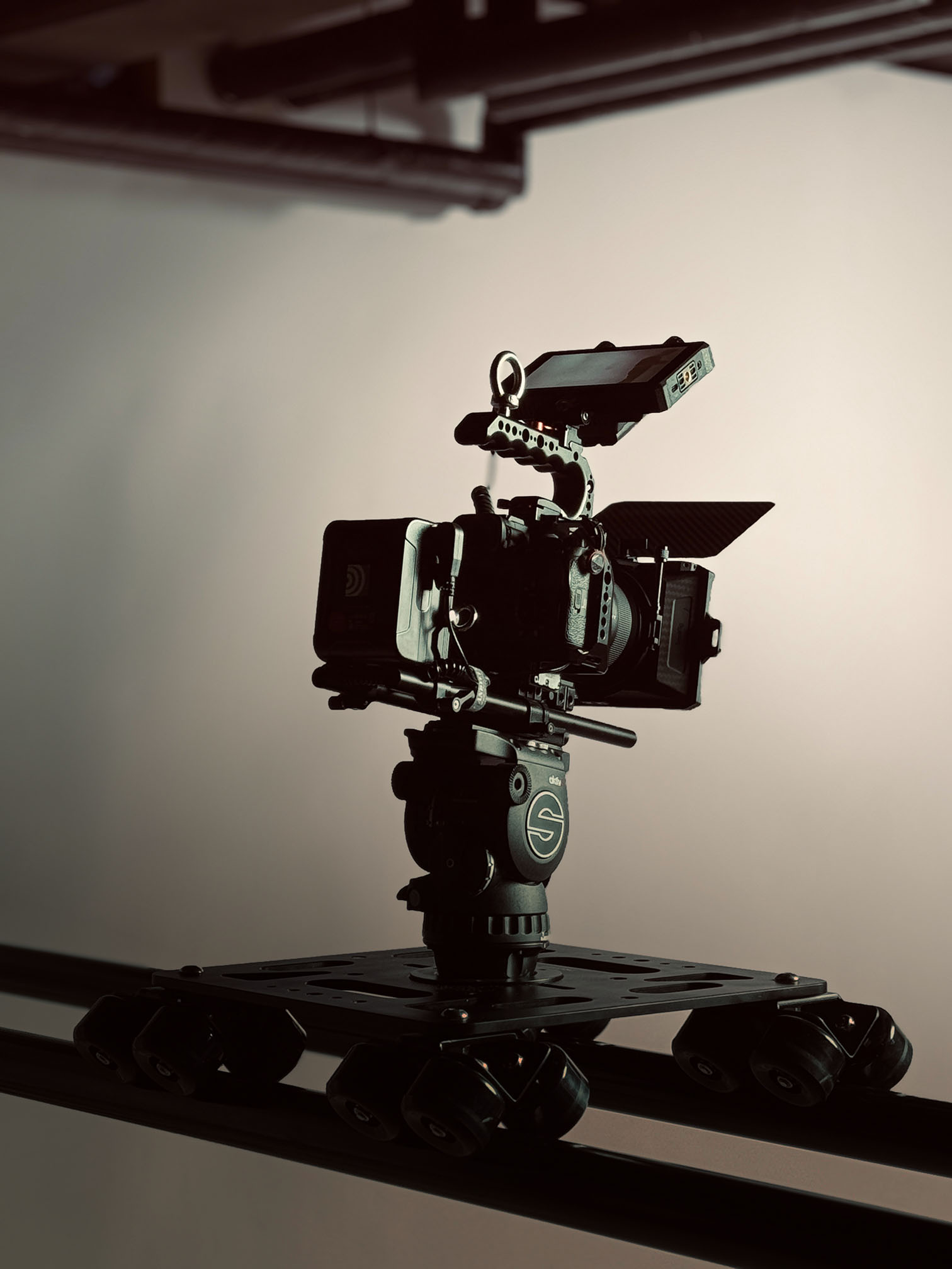 High-end film camera setup on a dolly for ads and film production campaigns.