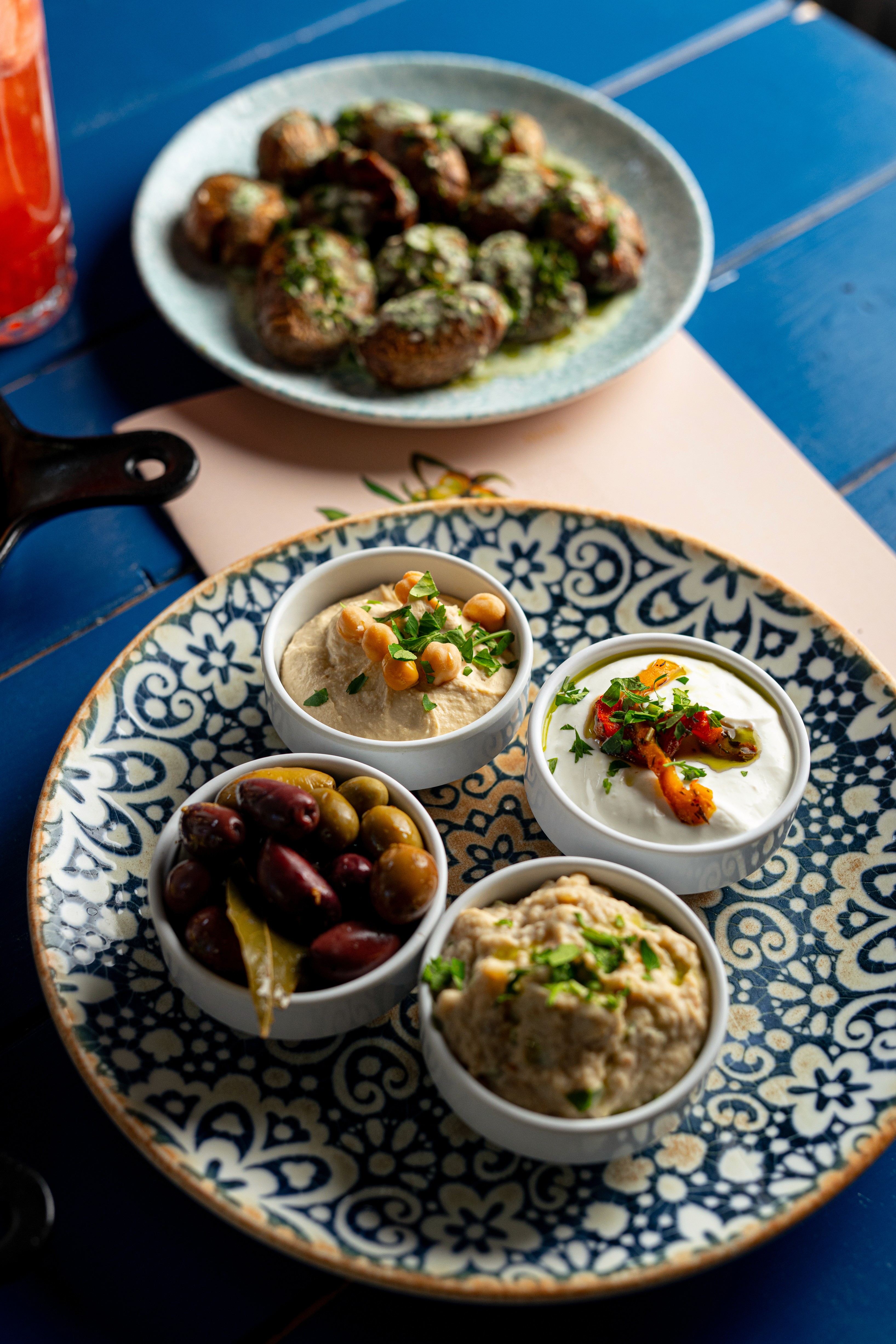 People sharing food at Mazeltov restaurant