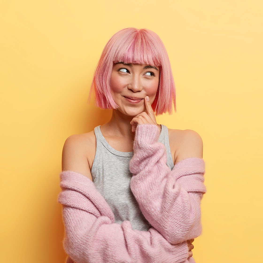 Cheerful dreamy woman with bob hairstyle