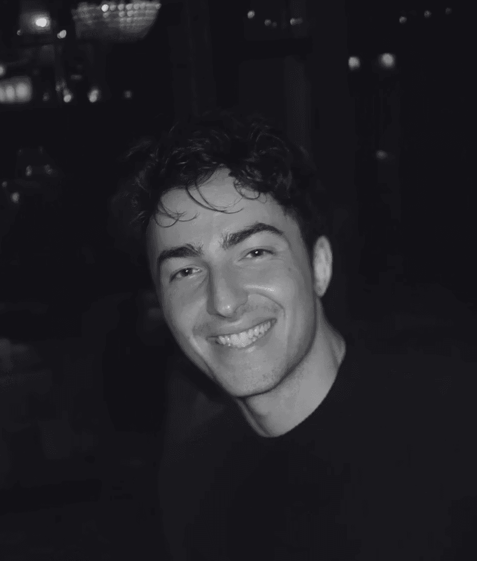 headshot of male in dark background