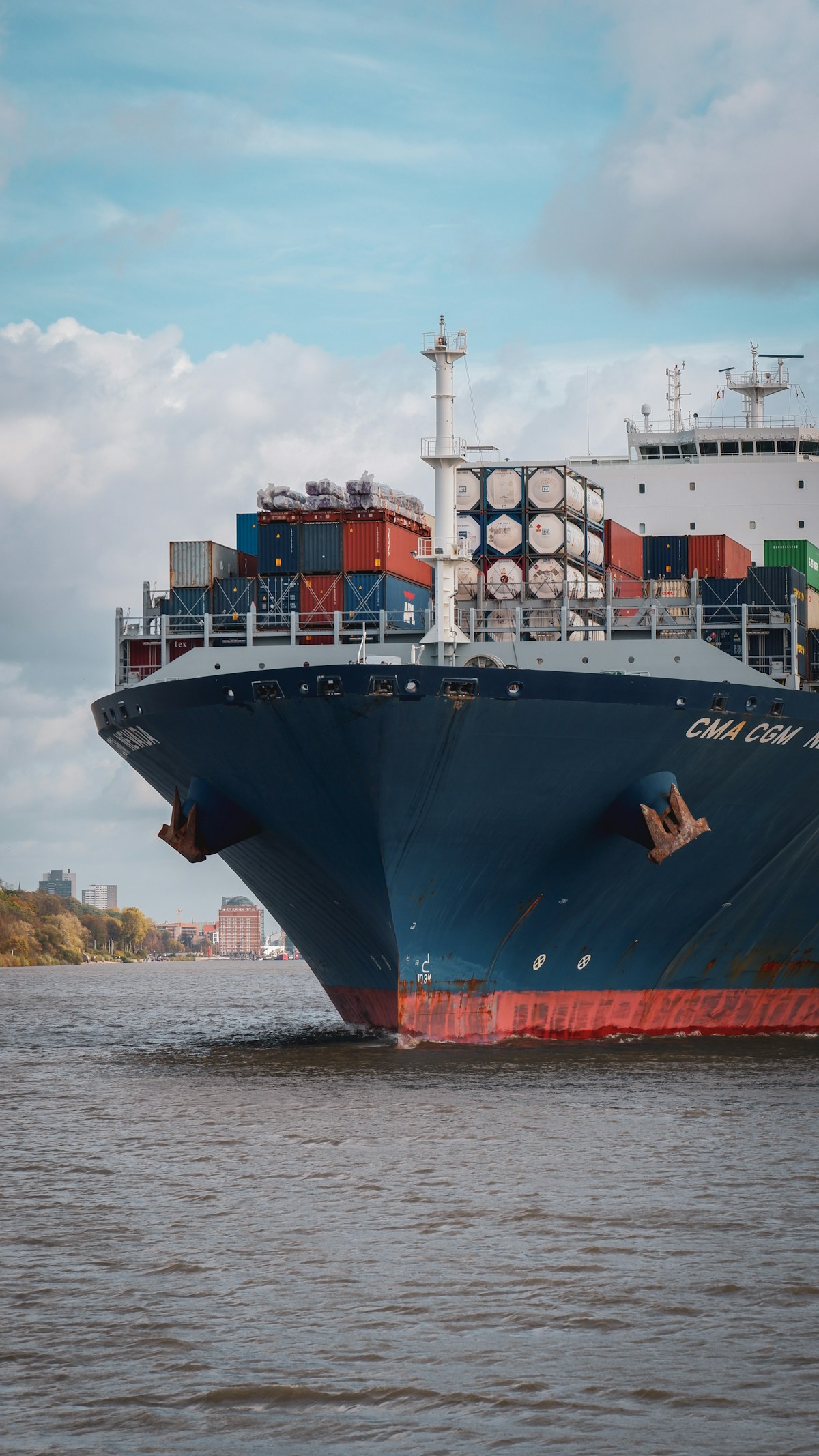 A container ship loaded with cargo on its way into port