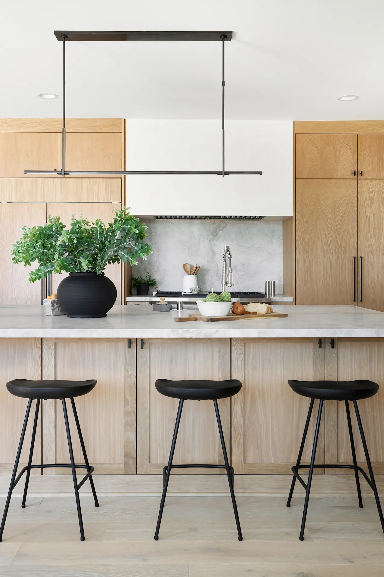 Portrait view of the kitchen island, emphasizing its size and placement within the Fullerton kitchen. Photo by Todd Huge.