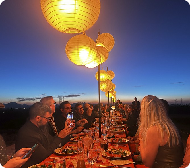 Adanac Sales residential team dinner on a beach at sunset