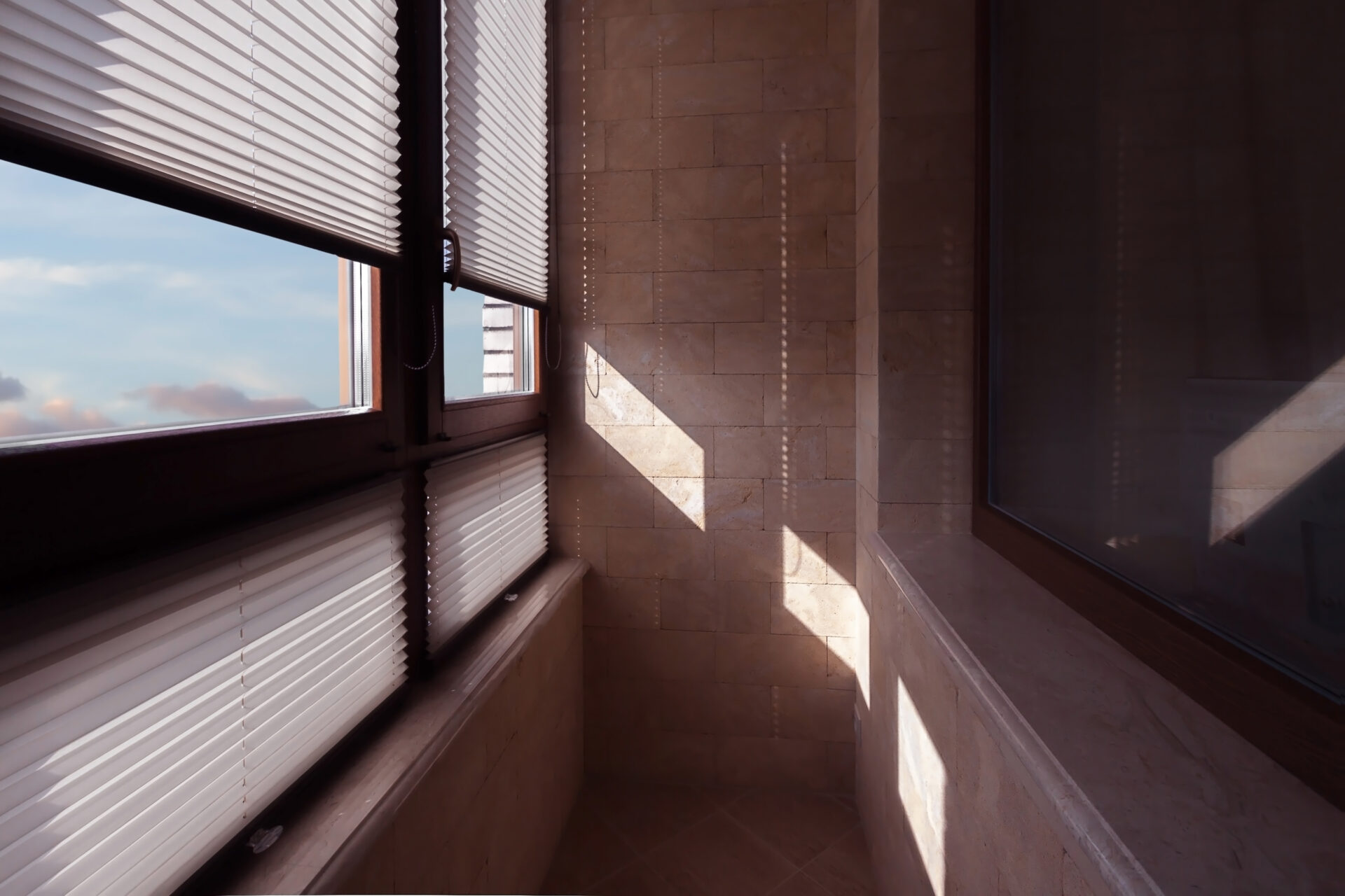 Light partially coming through interior with Somfy blinds. Wholesale Blind Factory