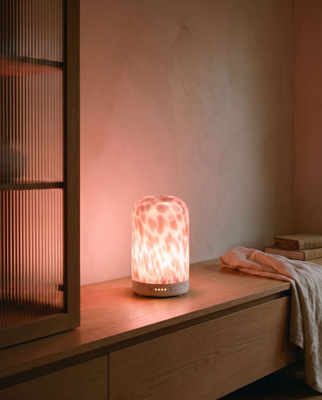 Still: the pod glowing in a calm living room in early evening