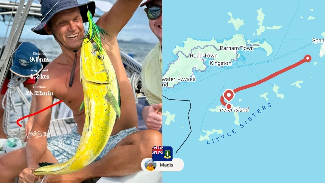 A man on a sailboat catching a fish in the British Virgin Islands