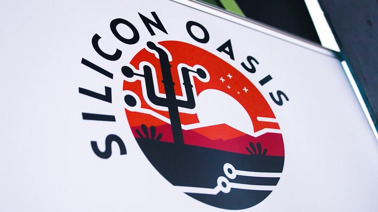 a black and white living room with a large tv