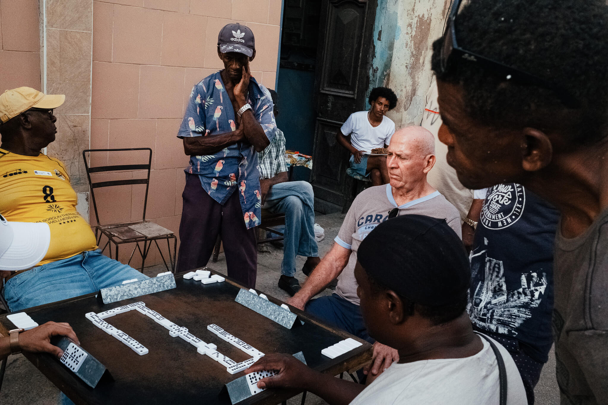 MEN KILLING TIME PLAYING IN THE STREETS