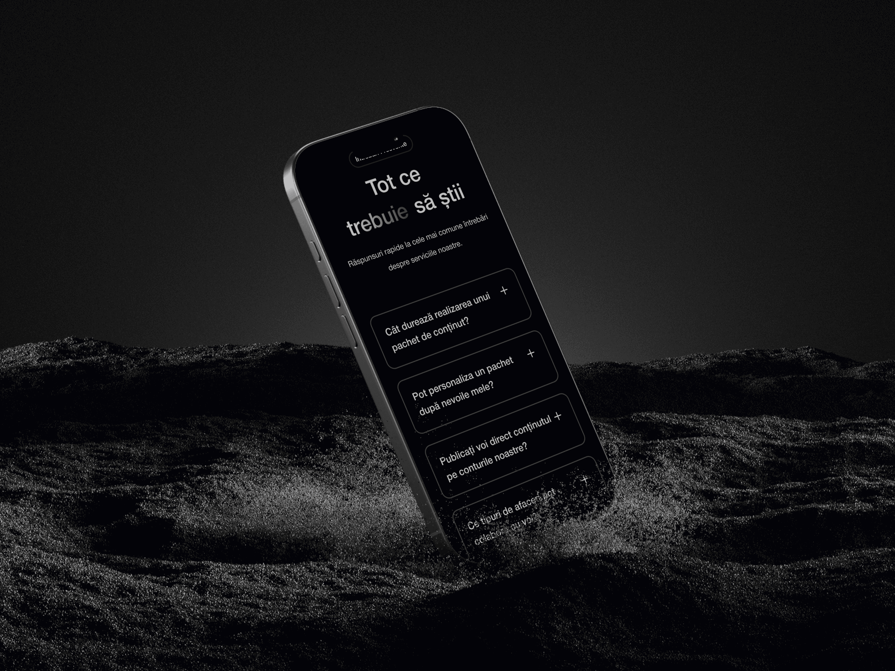 a cell phone on sand showing moment media website